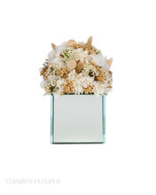 Beige Flowers in a Mirror Vase