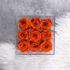 9 Orange roses that lasts a year in a box.