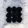 An acrylic box of 9 black roses that lasts a year.